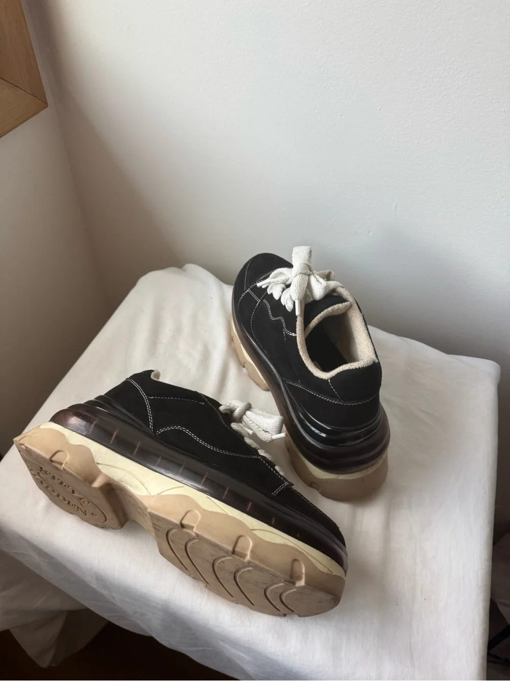 Steve Madden Evolved Sneaker in black with a chunky cream and tan platforms 9.5